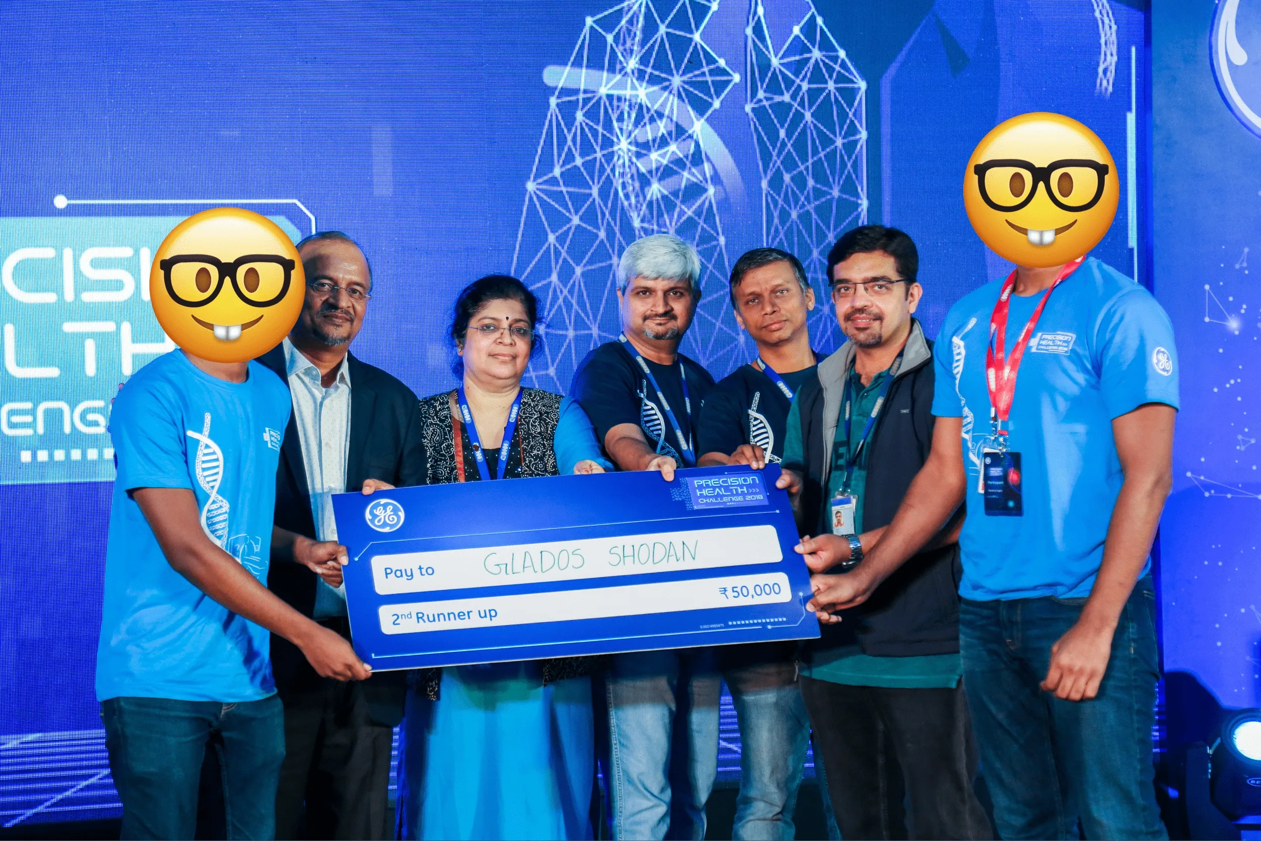 Our team holding a cheque of 50,000 rupees